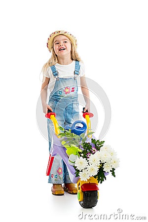 Kid girl with potted flowers and gardening equipment Stock Photo