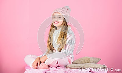 Kid girl wear knitted soft hat pink background. Keep knitwear soft after washing. Soft knitted accessory. Tips for Stock Photo