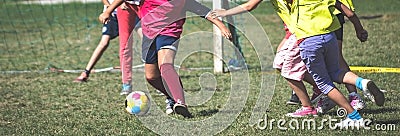 Kid girls play football attacking Stock Photo