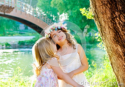 Kid girls playing in spring outdoor river park Stock Photo