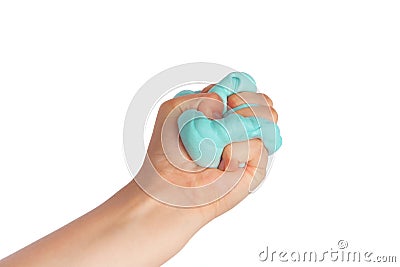 Kid hand holding and squeezing blue slime in front of a white Stock Photo
