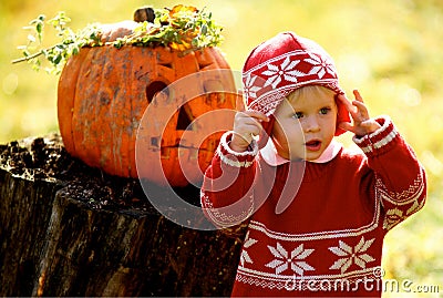 Kid and Helloween Pumpkin Stock Photo