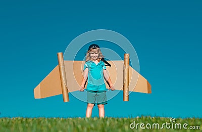 Kid with jet pack superhero. Child pilot against summer sky background. Success, leader and winner concept. Imagination Stock Photo