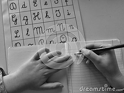 Kid learning cursive handwriting Stock Photo