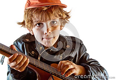 Kid learning to play guitar Stock Photo