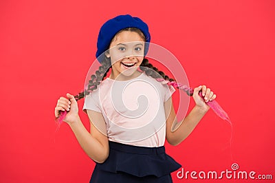 Kid little cute girl smiling face posing in hat red background. How to wear french beret. Beret style inspiration. How Stock Photo