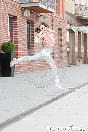 Kid long hair enjoy walk with favorite song. Music drives her life. Time to move your body. Summer vacation and tourism Stock Photo