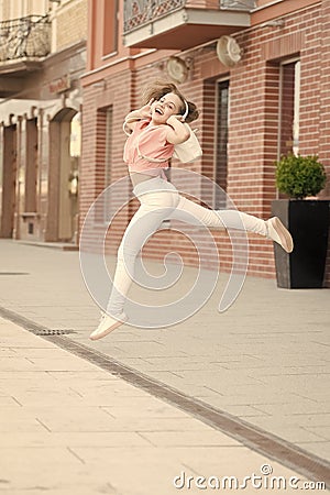 Kid long hair enjoy walk with favorite song. Music drives her life. Time to move your body. Summer vacation and tourism Stock Photo