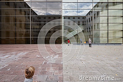 Kid looking at a group playing. Editorial Stock Photo