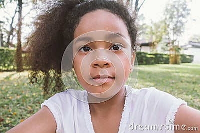 Kid mixed race African-American girl selfie outdoor Stock Photo