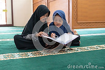 Kid muslim reading quran Stock Photo