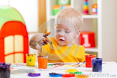 Kid painting at home Stock Photo