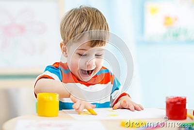 Kid painting at home Stock Photo