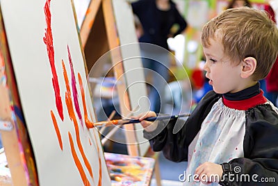 Kid painting at preschool Stock Photo