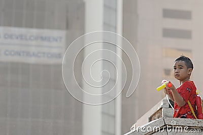 Kid play water during Songkran Editorial Stock Photo