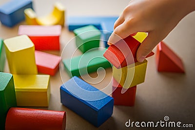 Kid play wood blocks Stock Photo