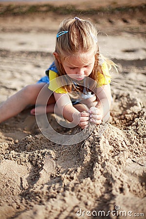 Kid playing on beach Stock Photo