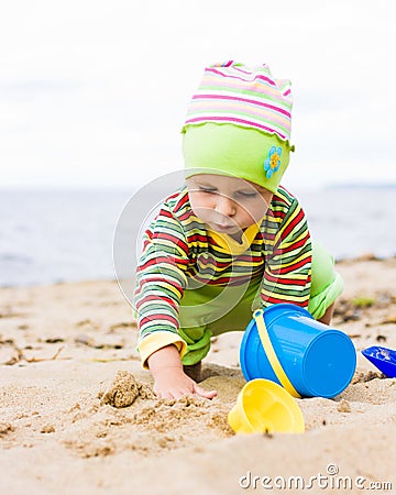 Kid playing on the beach Stock Photo