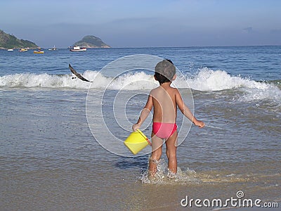 Kid playing in the beach Stock Photo