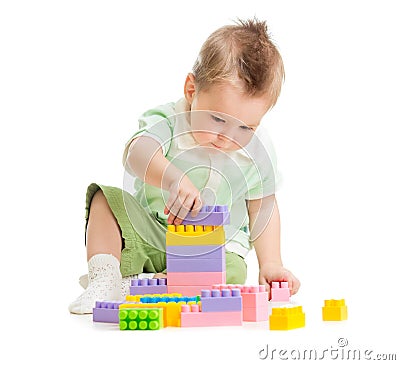 Kid playing colorful toy building blocks Stock Photo