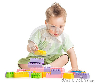 Kid playing colorful building blocks Stock Photo