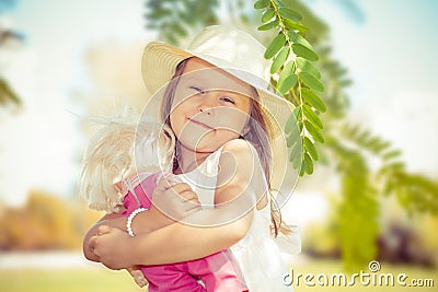 Kid playing with her doll Stock Photo