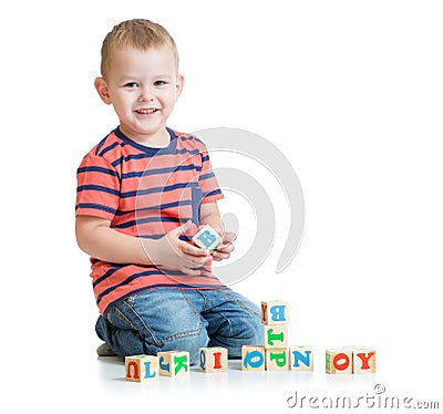 Kid playing with letter blocks isolated Stock Photo