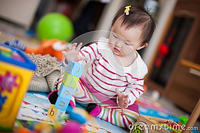 Kid playing toys Stock Photo