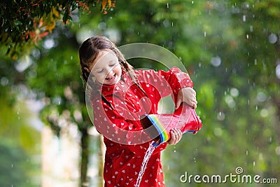 Kid with rain boots. Waterproof wear for children Stock Photo