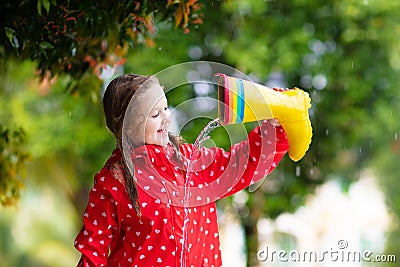 Kid with rain boots. Waterproof wear for children Stock Photo