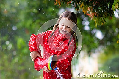 Kid with rain boots. Waterproof wear for children Stock Photo