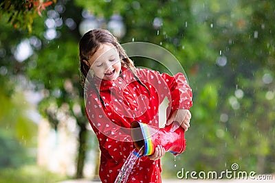Kid with rain boots. Waterproof wear for children Stock Photo