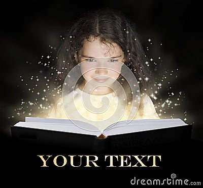 Kid reading the magic book Stock Photo