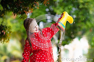 Kid with rain boots. Waterproof wear for children Stock Photo