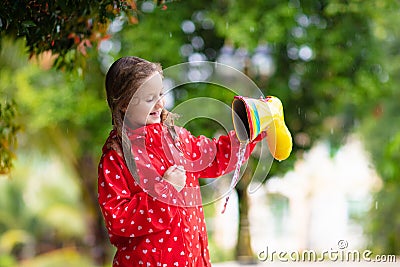 Kid with rain boots. Waterproof wear for children Stock Photo