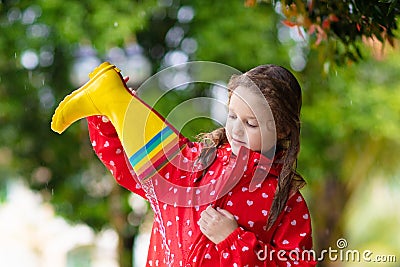 Kid with rain boots. Waterproof wear for children Stock Photo