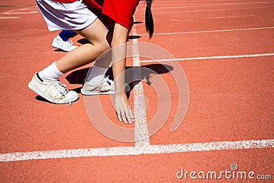 Kid runing on track in the Stadium Stock Photo