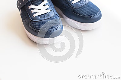 Kid s sport shoes. Isolated on white background with clipping path.pair of blue and white sneakers on white. kids Stock Photo