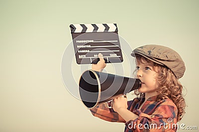 Kid shouting through megaphone Stock Photo