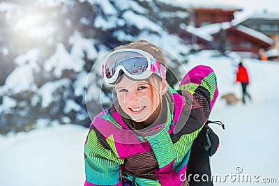 Kid in ski outfit and goggles Stock Photo