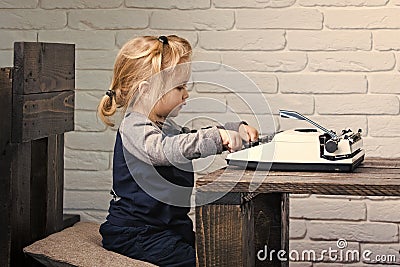 Kid or small boy or businessman child with typewriter Stock Photo