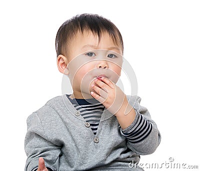 Kid snacking on cracker Stock Photo