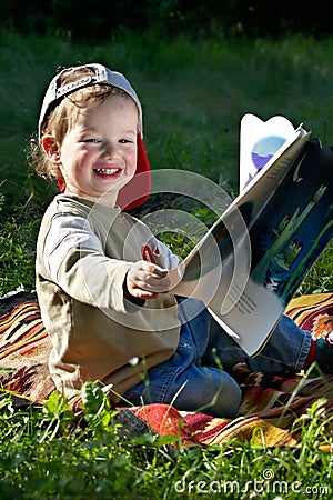 The kid studies to read Stock Photo