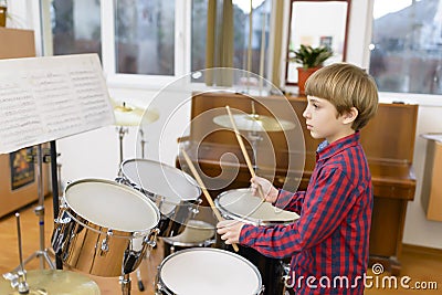 Kid Studying Drums Stock Photo