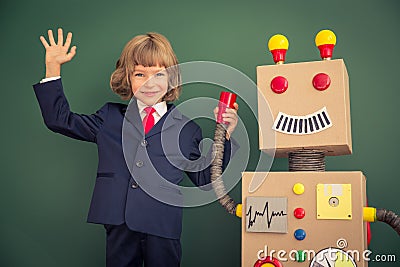 Kid with toy robot in school Stock Photo