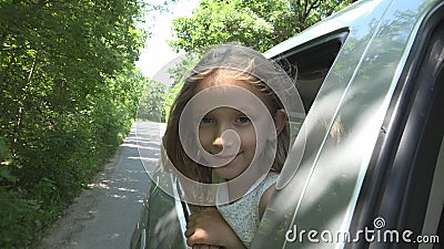 Kid Traveling by Car, Child Face Looking Out the Window, Girl Admiring Nature Stock Photo