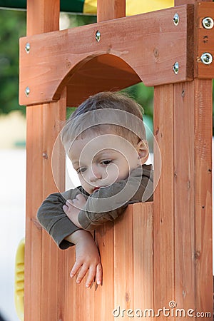 Kid in treehouse Stock Photo