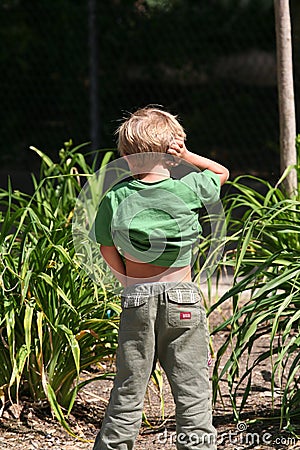 Kid urinating Stock Photo