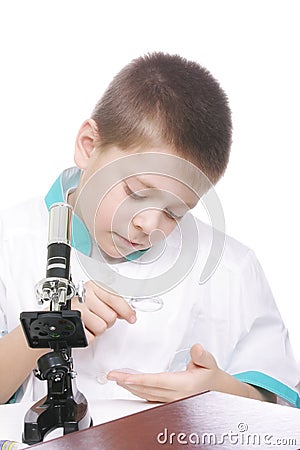 Kid using magnifying glass Stock Photo