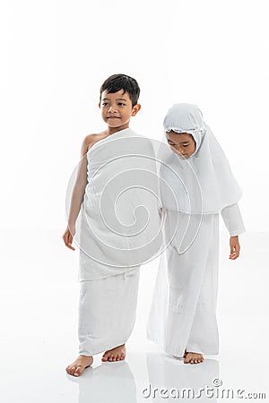 Kid wearing muslim ihram clothes and dress Stock Photo